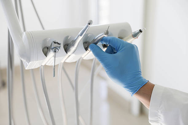 Professional Tooth Extraction technician working in Oscoda County County, MI